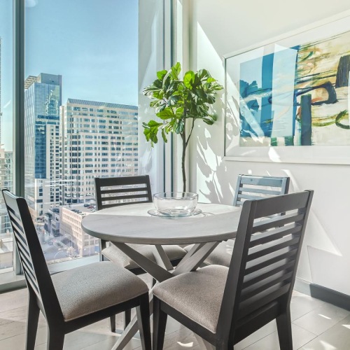 Beautiful living spaces with natural lighting a table and chairs in a room