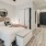 a bedroom with a bed and a bench