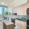 a kitchen with a table and chairs