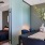 a bedroom with a bed and a desk