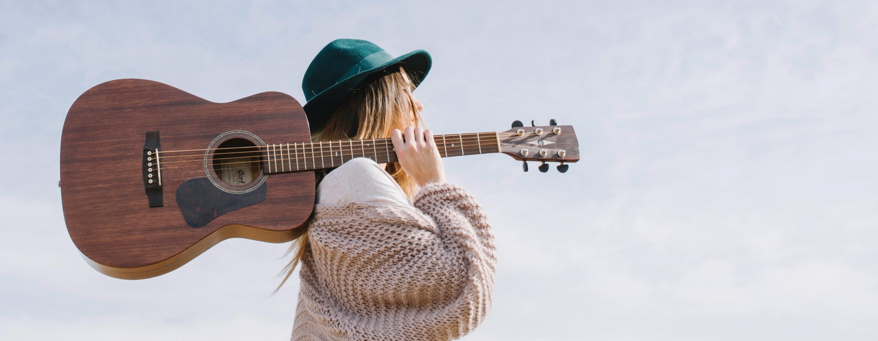 a woman holding a guitar